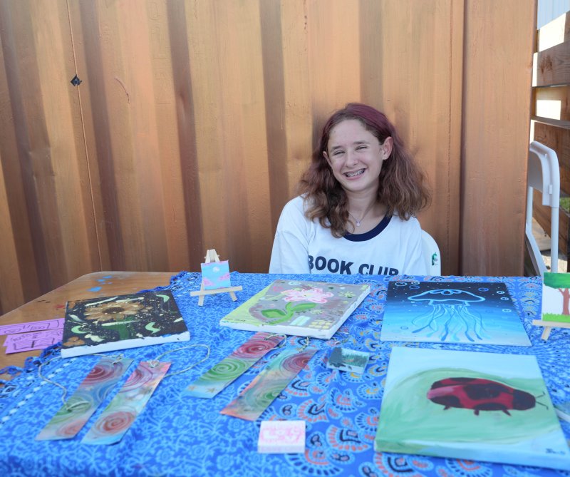Sadie Strumpf, a seventh-grader at Fred Thomas Middle School, sells paintings and bookmarks. She’s been painting for five or six years.