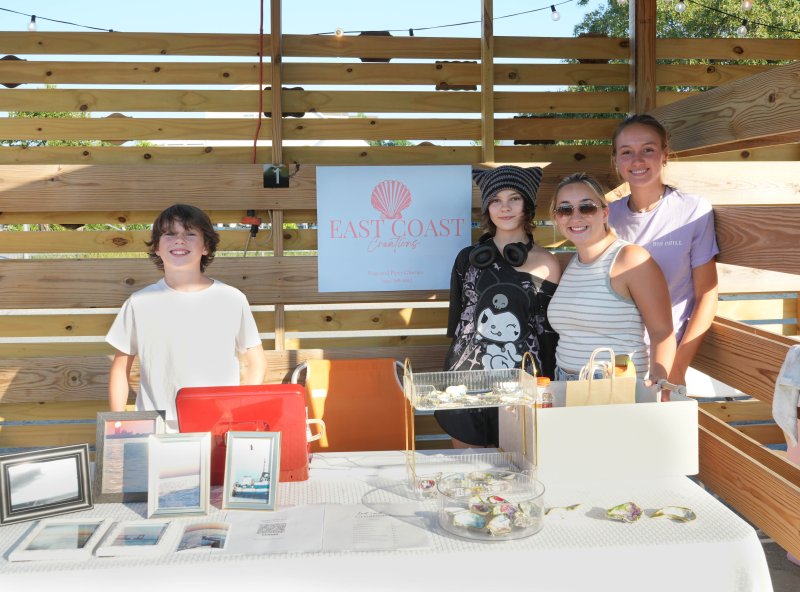 Eighth-grader Piper Cherico sells the colorful shells she made while her brother Blair sells his beach photos. Shown are (l-r) Blair Cherico, Piper Cherico, sister Sage Cherico and her friend Gracie Elder.