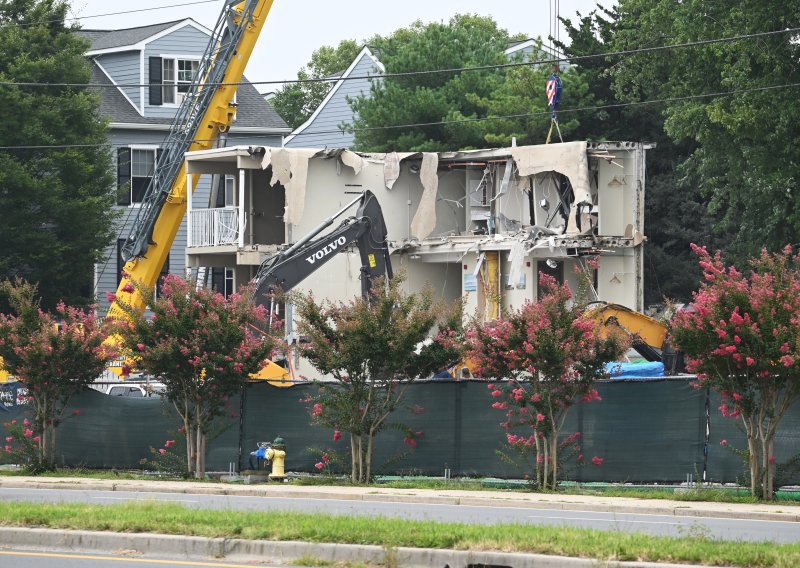 Demo crews work to knock down the rest of the hotel Aug. 6.