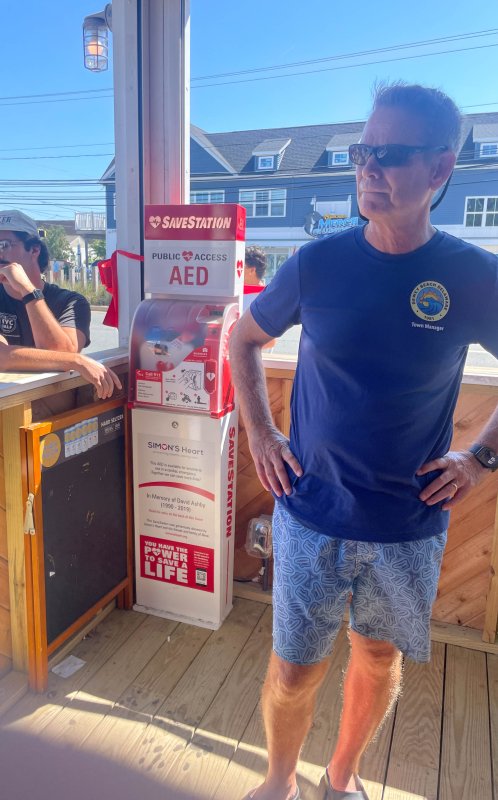 Dewey Beach Town Manager Bill Zolper stands by the AED tower at The Starboard Aug. 9.