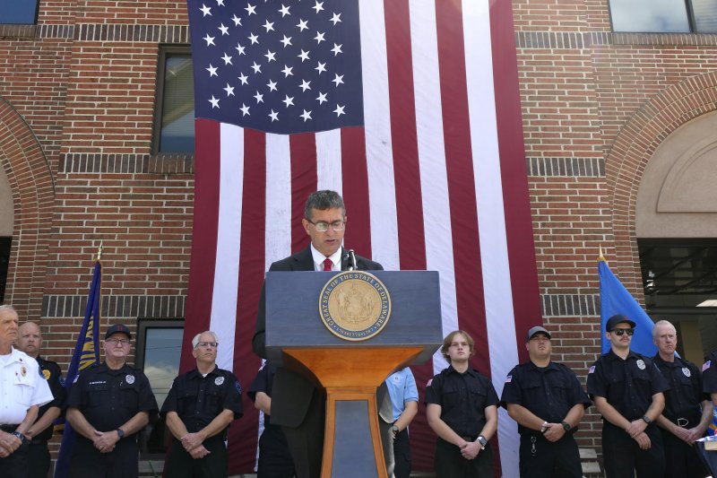 Gov. Matt Meyer signs a law allowing credit for high school students who are volunteer firefighters. OFFICE OF THE GOVERNOR PHOTO