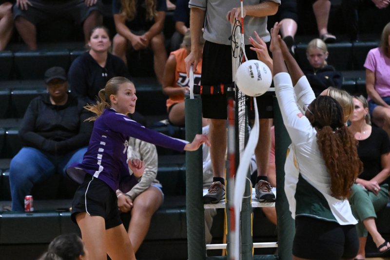 Royals freshman Addison Light pounds a kill through the defense.