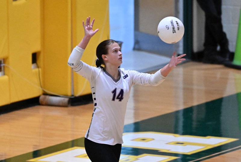 Royals sophomore libero Morgan Stevenson serves a winner.