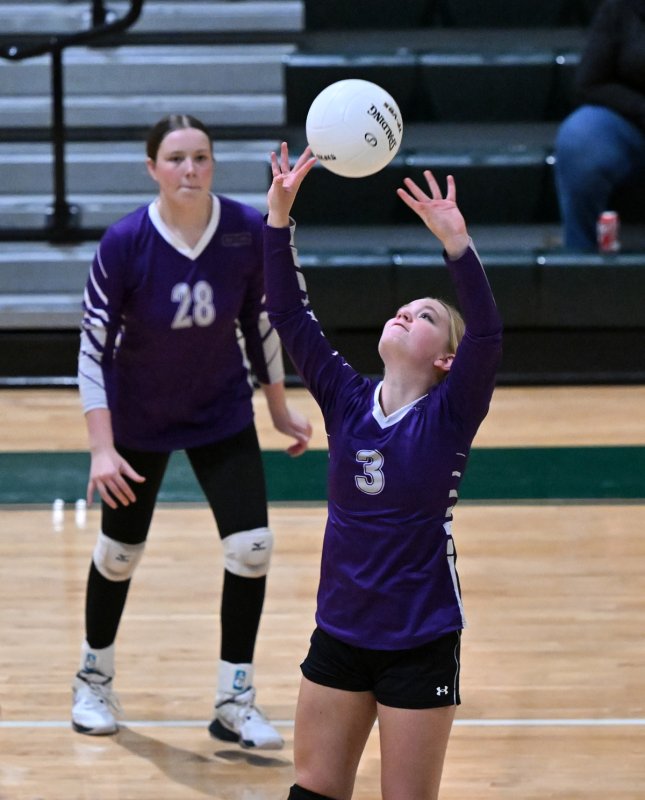 Royals setter puts up an assist to teammate Katherine Jones.