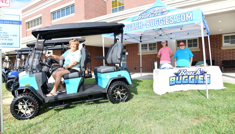 Beach Buggies owner Donna Tribull, left, is ready to ride with her employees Cheryl Stewart and Cindy Garrish.