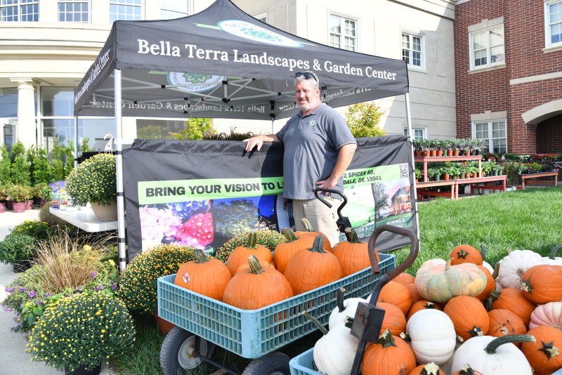 Bella Terra Landscapes General Manager Jay Millman stands with the many pumpkins for sale at the event.