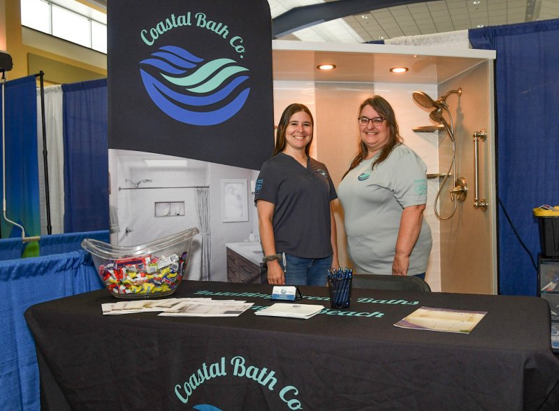 Giving information about Coastal Bath are Laura McBroom, left, and Stephanie Lackie.
