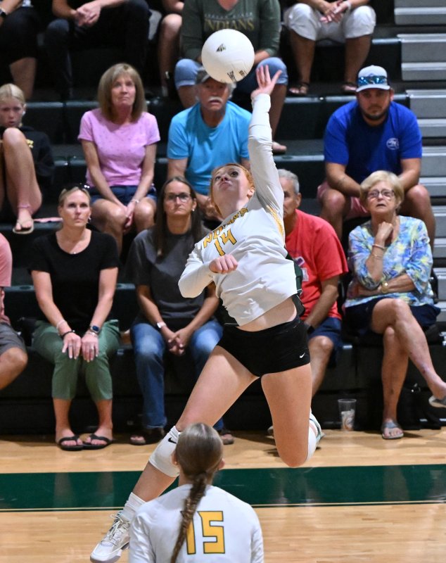 IR freshman Brenda Pahren slams a kill.