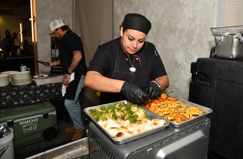 Nancy James of Fins prepares the halibut chop.