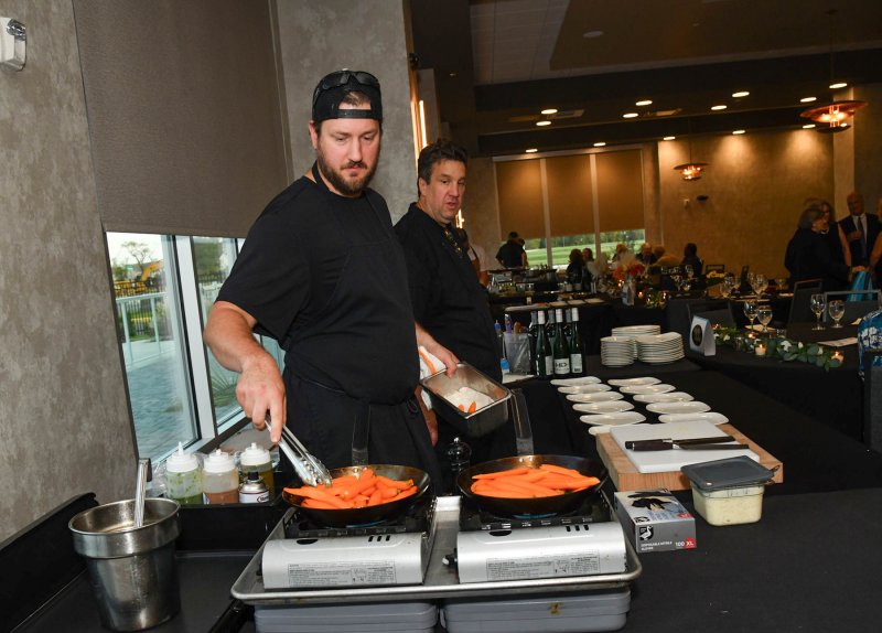 Working on cumin-crusted baby carrots is Ryan Steele of Cafe Azafran.