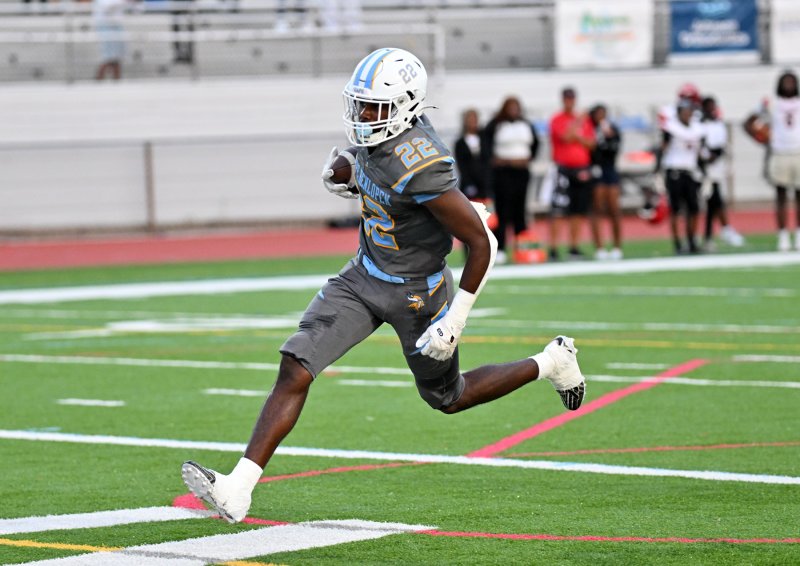 Oz Batson runs in for one of his two touchdowns. DAN COOK PHOTOS