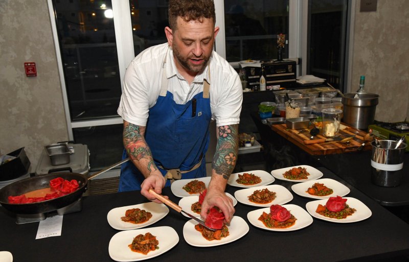 Paul Gallo of Abbott’s Grill prepares ravioli in the shape of a rose with parsnips and rabbit cacciatore.