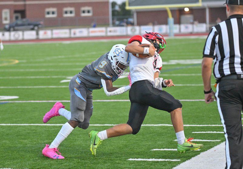 Cape defensive back Navin Duffy, left, rides William Penn quarterback Cameron Gardner out of bounds on the sideline.