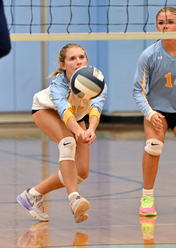 Cape junior libero Amara Fruchtman bumps a return of serve.