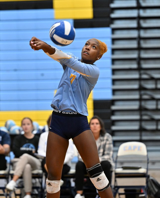 Cape senior McKenzie Everson bumps a return of serve.