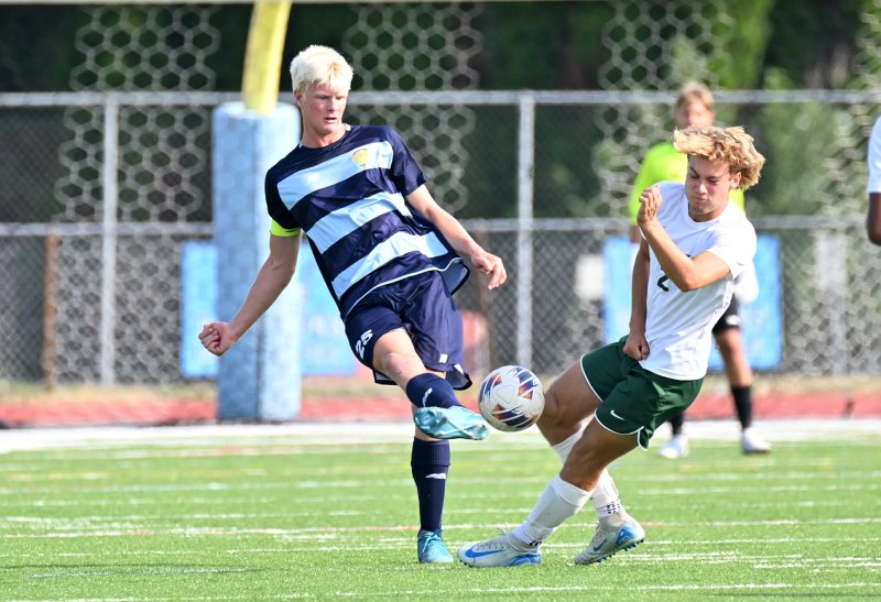 Cape defenseman Brenner Short slams the ball past Chase Wood.