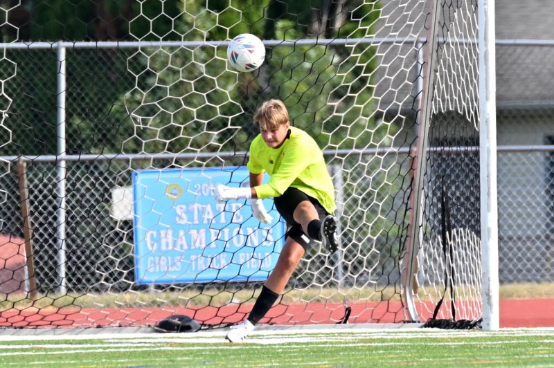 Cape goalie Anton Schierenberg blasts a clear after a save.