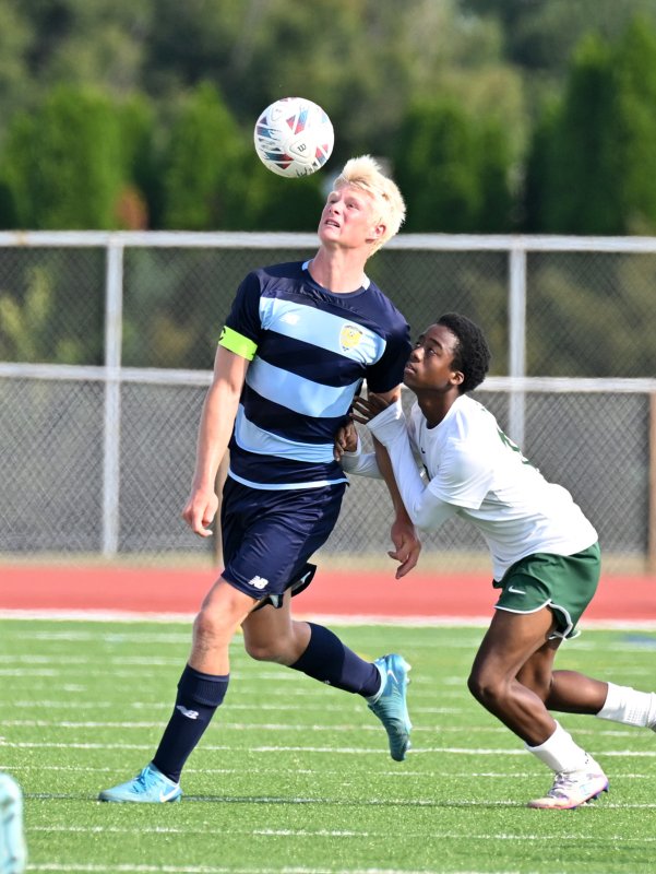 Cape senior defender Brenner Short looks to control the ball away from sophomore Zy'Air Green.