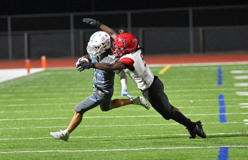 Cape’s Aidan Lehmuth runs out of the tackle attempt by Chase Foxworth.