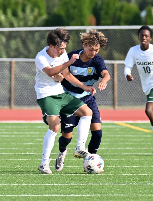 Cape freshman Hedgie Swier, right, battles for possession with Odessa’s Cole Money.