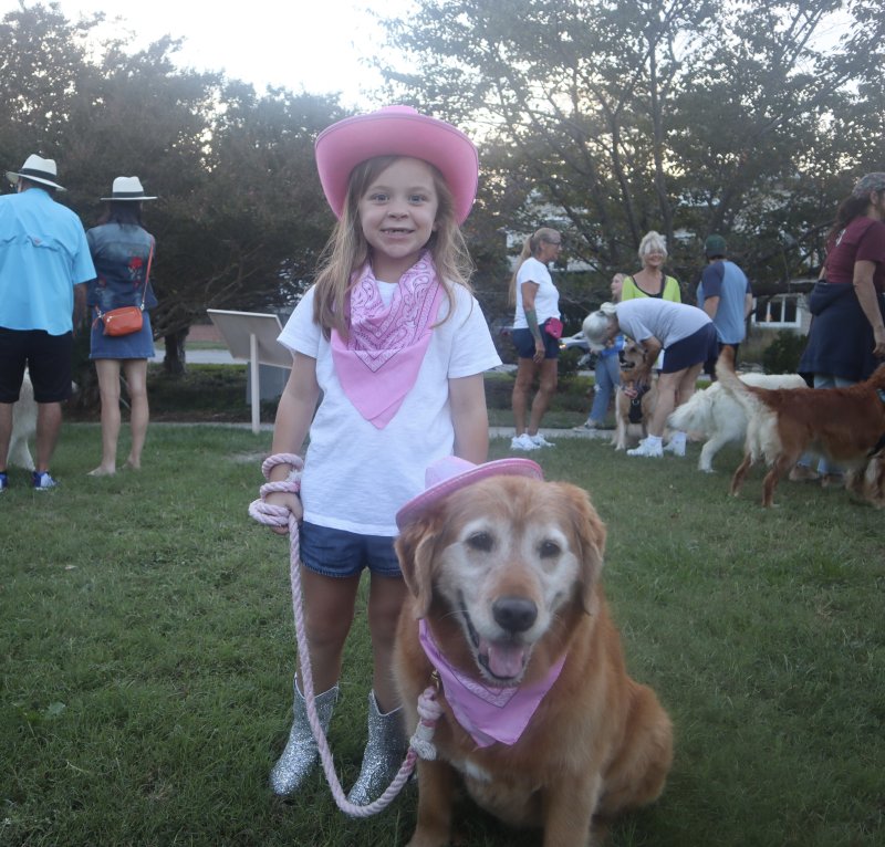 Grace Laird and her golden Fenwick show off their matching cowgirl outfits.