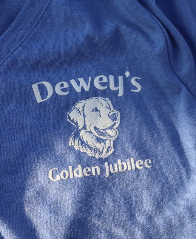 The logo adorns various T-shirts on sale for participants.