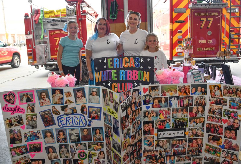 The White Ribbon Club includes (l-r) 12-year-old Katie Nauman, Meghan Hill, Brandy Nauman and 9-year-old Kendall Nauman. The team honors Erica Colegrove, who lost her battle with cancer Aug. 30.