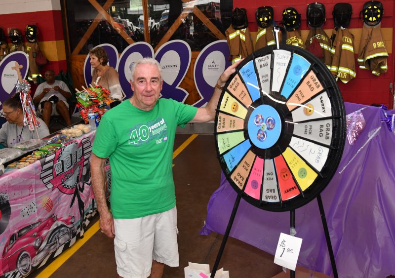 Relay for Life Marketing Director Rob Smith runs the prize wheel.