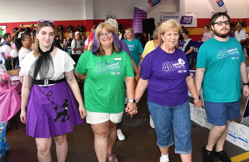 Walking the survivors’ lap are (l-r) Carmie Blanchette; Kathy Blanchette; Phyllis Masten, an esophageal cancer survivor of six years; and Anthony Blanchette.