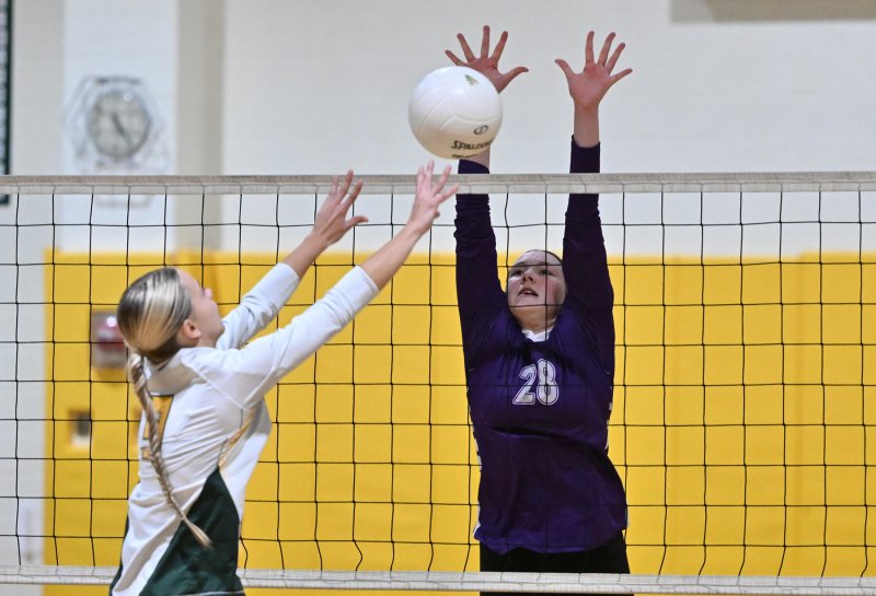 Delmarva Christian middle blocker Katherine Jones goes for the roof on Indian River’s Isabelle Dorey in the 3-0 Indians’ victory. DAN COOK PHOTOS