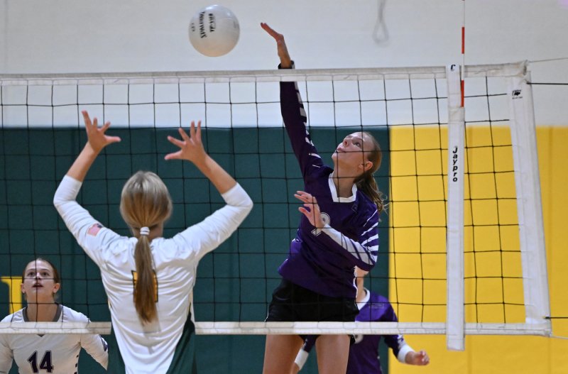 Royals freshman Addison Light knocks down a kill.