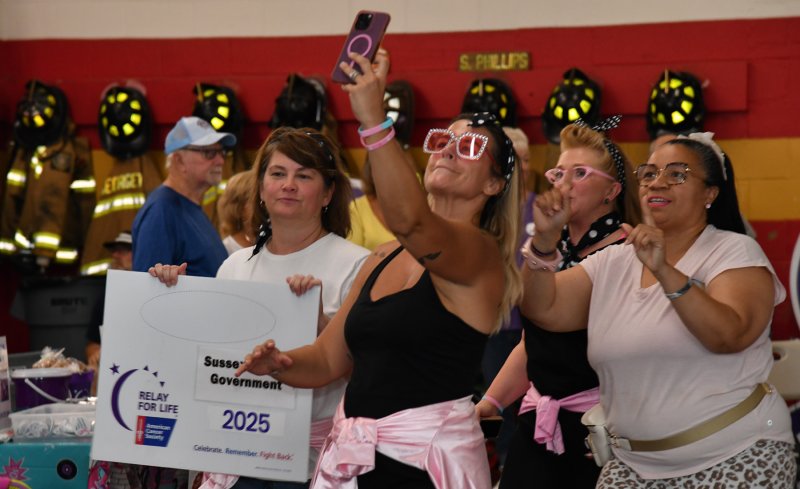 The Pink Ladies team takes a selfie during the survivor walk.