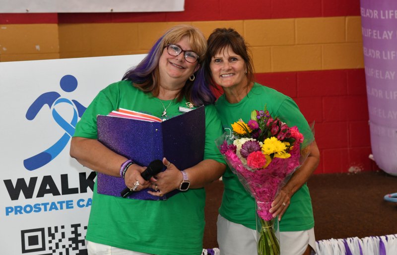 Kathy Blanchette, Relay for Life volunteer chair, presents an appreciative bouquet to Debbie White, senior development manager in the Northeast Region.