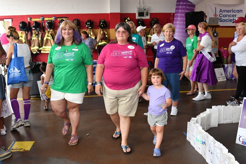 Walking the Grand Club/All-Star lap are (l-r) Kathy Blanchette, Relay for Life volunteer chair; Heather Crouse, co-captain for the Sunshine 4-H team, and her niece Addison Hood.