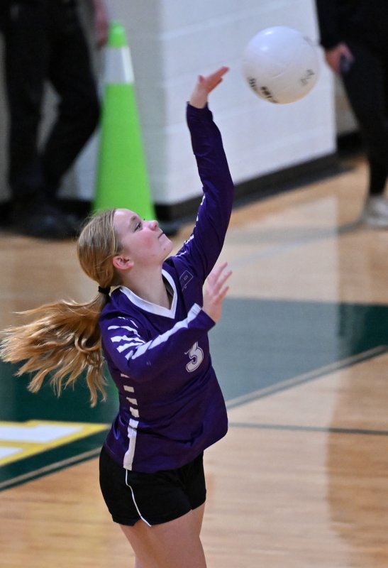 Freshman Raegan Bryant serves a winner for the Royals.