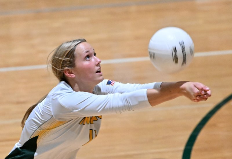 IR junior Taylor Hevner bumps one of her 10 assists.