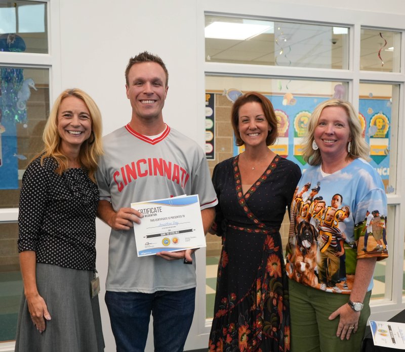 Cape High social studies teacher Jon Day receives the district’s Going the Extra Mile staff award for September. Shown are (l-r) Superintendent Jenny Nauman, Day, Board President Alison Myers and Cape Principal Kristin DeGregory. ELLEN MCINTYRE PHOTOS