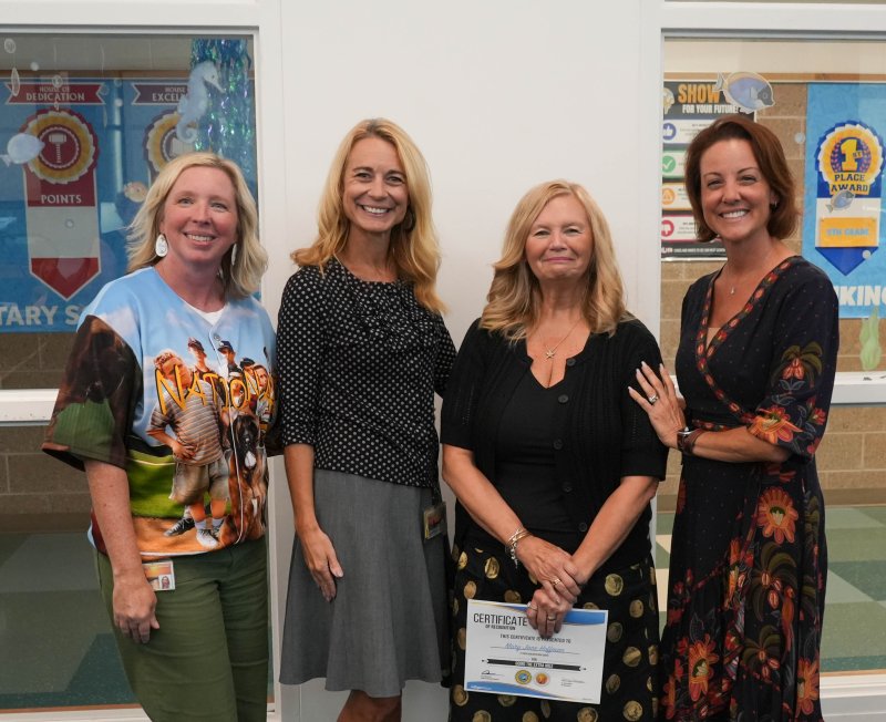 Long-term multilingual learner substitute Mary Jane Hoffman receives Cape’s Going the Extra Mile substitute award for September. Shown are (l-r) Principal Kristin DeGregory, Superintendent Jenny Nauman, Hoffman and Board President Alison Myers.