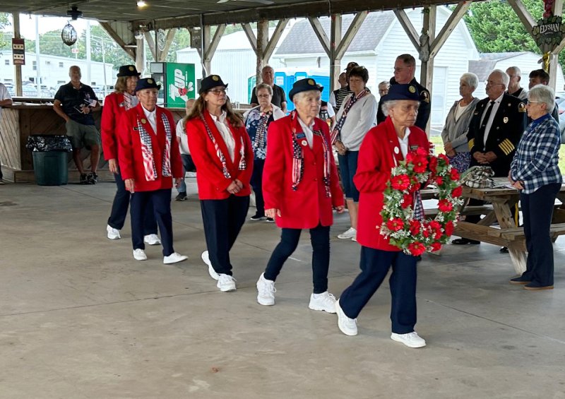 The Post 28 color guard lays a ceremonial wreath.