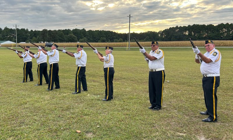 The American Legion Post 28 honor guard gives a 21-gun salute for the victims of the 9/11 attacks.