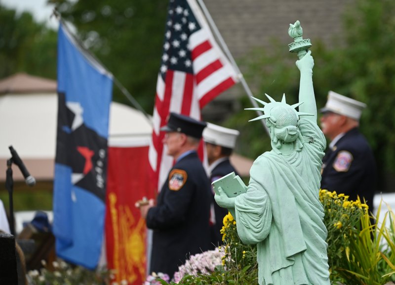 Members of the FDNY stand in front of the Whitford home outside Lewes for the family’s annual Sept. 11 remembrance ceremony. NICK ROTH PHOTOS