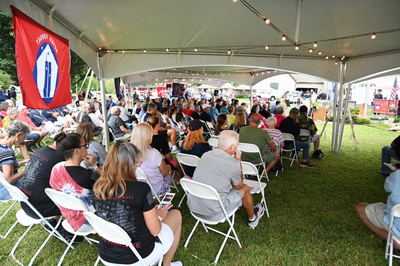 A large crowd attends the Whitford family’s annual 9/11 remembrance ceremony.