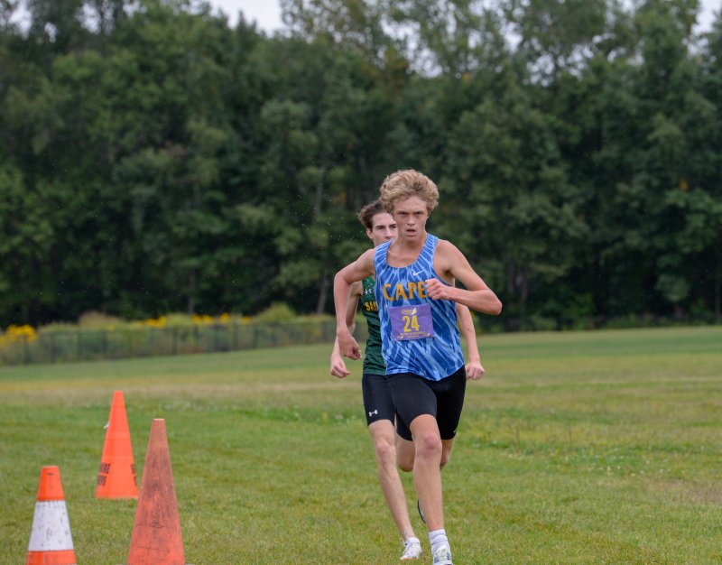 Cape’s Jason Baker (15:37) outkicks Alec Jurgaitis (15:38) to the finish line.
