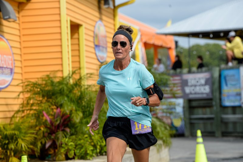 Jennifer Hagan wins her age group in 27:33 at the Stop, Drop & Run 5K.