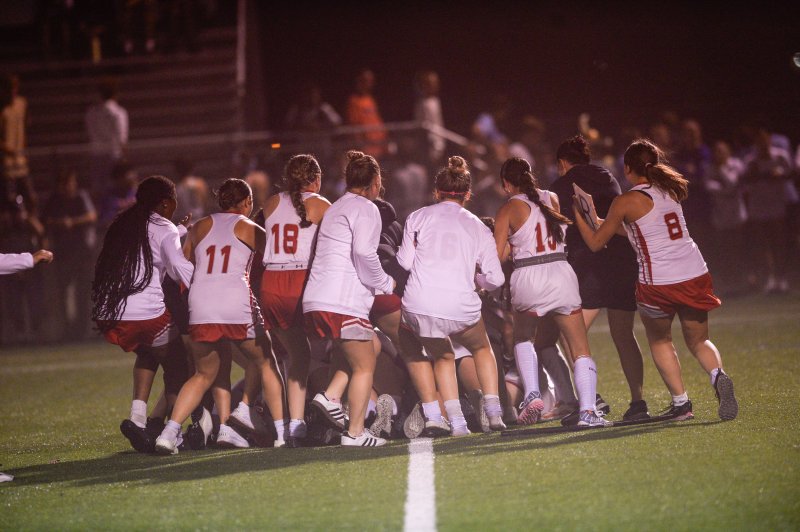 Smyrna players storm and surround the goalie after their sudden victory over Cape. DAVE FREDERICK PHOTO