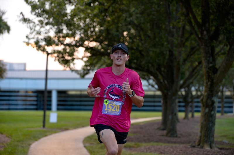 Dylan Branch wins the Run, White & Blue 5K in 16:20.