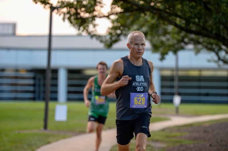 Gavin Furlong wins the male masters race at the Run, White & Blue 5K in 17:57.