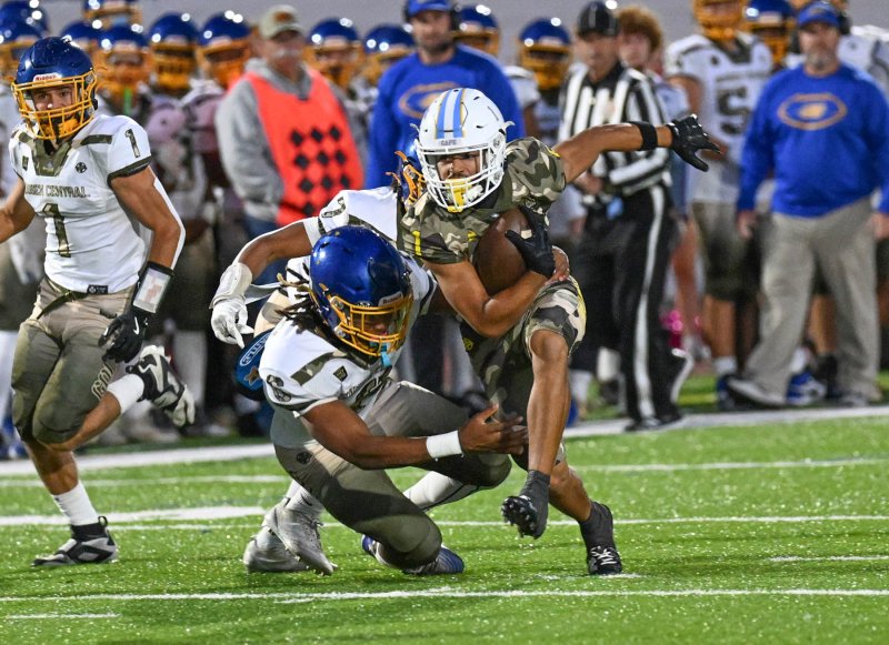 Lamar McCoy runs out of a tackle attempt from Central’s Armon Floyd-Satchell.