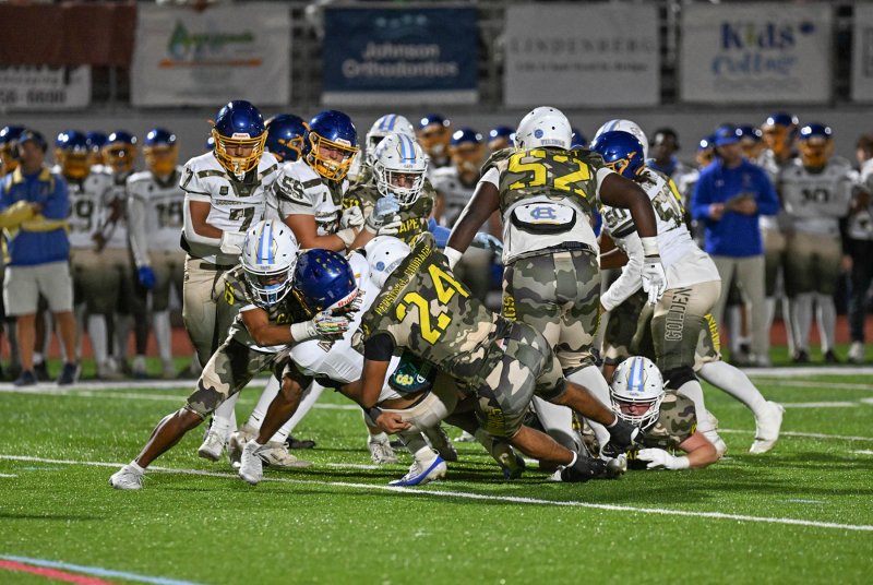 The Cape defense brings down Central’s Armon Floyd-Satchell.