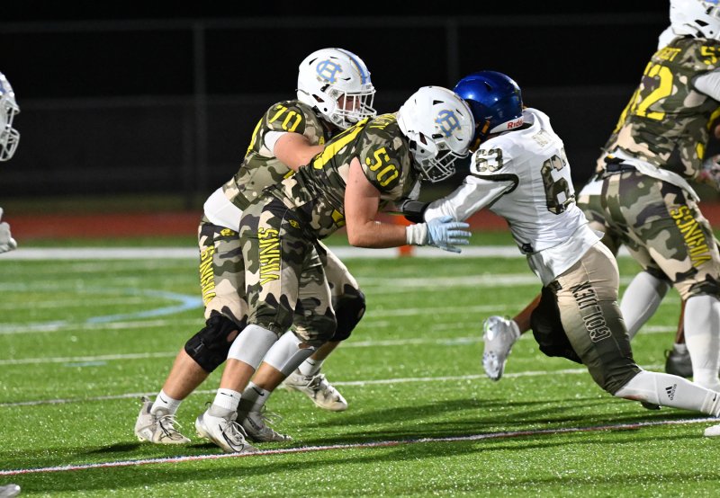 Cape center Robbie Payton blocks for Jameson Tingle.